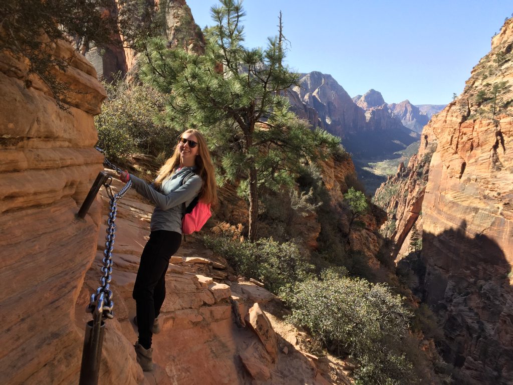 Erin hanging on the edge of Angel's Landing in Zion National Park.